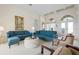 Spacious living room with high ceilings, comfortable seating, and elegant decor, creating a welcoming and airy atmosphere at 872 Macaw Cir, Venice, FL 34285
