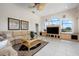 Spacious living room features built-in media center and large windows with scenic views at 872 Macaw Cir, Venice, FL 34285