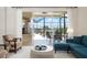 Bright living room featuring comfortable seating, sliding doors to the pool, and elegant decor, creating an inviting space at 872 Macaw Cir, Venice, FL 34285