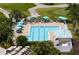 This refreshing pool overlooks the golf course and has several lounge chairs and umbrellas for relaxing at 872 Macaw Cir, Venice, FL 34285