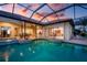 This private pool with attached spa and screened-in patio offers indoor/outdoor living and entertaining at 872 Macaw Cir, Venice, FL 34285