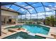 Beautiful screened-in swimming pool and spa area with scenic waterfront views and convenient access to the home at 872 Macaw Cir, Venice, FL 34285