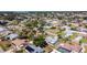 An aerial view showing a residential area with mature trees and various home styles at 985 Everest Rd, Venice, FL 34293
