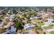 An aerial view capturing a residential neighborhood close to water with a mix of homes and landscaping at 985 Everest Rd, Venice, FL 34293