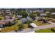Aerial view of a single-story home with a long driveway and mature landscaping at 985 Everest Rd, Venice, FL 34293