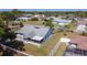 Aerial view of a single Gathering home with screen enclosed porch and fenced yard at 985 Everest Rd, Venice, FL 34293