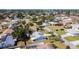 Aerial view of a well-maintained neighborhood with established trees and varied home designs at 985 Everest Rd, Venice, FL 34293