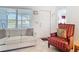 Cozy living room with neutral furniture and natural light from the window at 985 Everest Rd, Venice, FL 34293