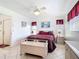 Bright bedroom with a ceiling fan, two windows and decorative furniture at 985 Everest Rd, Venice, FL 34293
