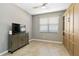 Comfortable bedroom with a built-in wardrobe, plenty of space and natural light, creating a serene retreat at 10093 Cozy Grove Dr, Venice, FL 34293