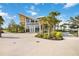 The Banyan House clubhouse boasts modern architecture, lush landscaping, and community gathering spaces at 10093 Cozy Grove Dr, Venice, FL 34293