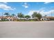 Sarasota National community entrance featuring meticulously landscaped grounds and beautiful signage at 10093 Cozy Grove Dr, Venice, FL 34293