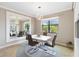 Modern dining room with table, chairs, decorative mirror, and stylish light fixture at 10093 Cozy Grove Dr, Venice, FL 34293