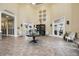 Spacious lobby area with elegant decor, high ceilings, and a welcoming atmosphere at 10093 Cozy Grove Dr, Venice, FL 34293