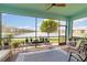 Relaxing porch with views of the lake, ideal for enjoying outdoor living with a beautiful setting at 10093 Cozy Grove Dr, Venice, FL 34293