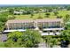Aerial view of condo complex with lovely landscaping and golf course views at 1018 Wexford Blvd # 1018, Venice, FL 34293