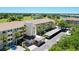 Exterior view of the condo buildings surrounded by a golf course and lush greenery at 1018 Wexford Blvd # 1018, Venice, FL 34293