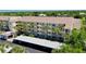 Spacious condo building with covered parking surrounded by mature landscaping at 1018 Wexford Blvd # 1018, Venice, FL 34293