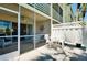 Enjoy the outdoors in this screened lanai featuring comfortable seating and lovely garden views at 1018 Wexford Blvd # 1018, Venice, FL 34293