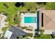 Aerial view of the pool and lounge area at the property with nearby parking at 1018 Wexford Blvd # 1018, Venice, FL 34293