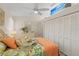 Bright main bedroom showcasing ample closet space and tropical-themed decor at 1025 Capri Isles Blvd # 18, Venice, FL 34292