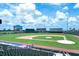 View of the baseball field at CoolToday Park with Coca-Cola Corner and shaded seating at 10618 Corkwood Ct, Venice, FL 34293