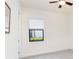Bright bedroom with a window offering natural light and a ceiling fan for added comfort at 10618 Corkwood Ct, Venice, FL 34293
