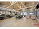 Expansive clubhouse featuring soaring ceilings, abundant seating and gorgeous wood-look flooring at 10618 Corkwood Ct, Venice, FL 34293