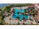 Beautiful community pool with lounge chairs and palm trees, perfect for relaxing and enjoying the Florida sunshine at 10618 Corkwood Ct, Venice, FL 34293