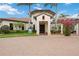 Beautiful entrance to the Palm Club, featuring lush landscaping and a welcoming facade at 10618 Corkwood Ct, Venice, FL 34293