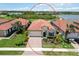 Well-maintained home with tile roof, manicured lawn, and attractive landscaping in a desirable community at 10618 Corkwood Ct, Venice, FL 34293