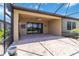 Covered outdoor patio with brick pavers, ceiling fan, and sliding glass doors to the interior at 10618 Corkwood Ct, Venice, FL 34293