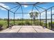 Large screened patio with brick floors offering beautiful water views at 10618 Corkwood Ct, Venice, FL 34293