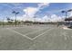 Well-maintained tennis court, ready for a game with friends and Gathering at 10618 Corkwood Ct, Venice, FL 34293
