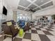 Bright clubhouse features modern décor, coffered ceilings, ample seating, and a community kitchen at 10973 Trevino St, Englewood, FL 34223