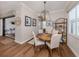 Cozy dining area featuring a round table, four chairs, and elegant lighting, ideal for intimate meals at 10973 Trevino St, Englewood, FL 34223