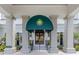 Welcoming entrance to Boca Royale Golf and Country Club with porte-cochere and elegant detailing at 10973 Trevino St, Englewood, FL 34223