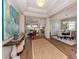 Open-concept home entrance with hardwood flooring and decorative accents at 10973 Trevino St, Englewood, FL 34223