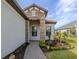 This home has a stone facade and a covered entryway at 10973 Trevino St, Englewood, FL 34223