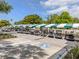 Organized parking area with a row of golf carts under shaded parking at 10973 Trevino St, Englewood, FL 34223