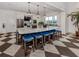 Large community kitchen island with granite countertops, seating for six, and stainless steel appliances at 10973 Trevino St, Englewood, FL 34223