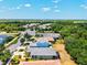 Expansive aerial view of a residential community featuring single-Gathering homes and lush green landscapes at 12478 Sagewood Dr, Venice, FL 34293
