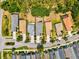 High angle aerial of the property, revealing its backyard, roof condition, and neighborhood layout at 12478 Sagewood Dr, Venice, FL 34293