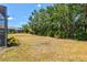 Expansive backyard with plenty of room and landscaping, along with a screened-in patio area at 12478 Sagewood Dr, Venice, FL 34293