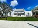 Exterior of a modern, white building with a well-manicured lawn, creating an inviting and professional atmosphere at 12478 Sagewood Dr, Venice, FL 34293