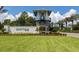 Attractive entrance to the Grand Palm community with lush landscaping at 12478 Sagewood Dr, Venice, FL 34293
