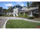 Beautiful home with manicured landscaping and a circular driveway at 12478 Sagewood Dr, Venice, FL 34293