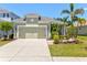Charming single-story home featuring a tile roof, two-car garage, and beautifully landscaped front yard at 12478 Sagewood Dr, Venice, FL 34293