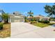 Lovely single-story home featuring a wide driveway, two car garage, and meticulously maintained front yard at 12478 Sagewood Dr, Venice, FL 34293