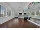 Spacious exercise room featuring hardwood floors, full mirrors, and fitness equipment at 12478 Sagewood Dr, Venice, FL 34293
